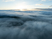 Aerial view of serene clouds above a tranquil landscape at sunrise,Eguisheim,France