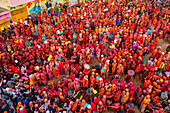 Nandgaon,India - 01 March 2023: Aerial view of people celebrating the holy colour festival at Shri And Baba Temple,Uttar Pradesh,India