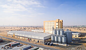 Aerial view of industrial building with metallic vats in Dubai,UAE