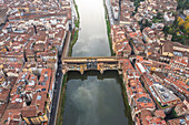 Aerial view of Ponte Vecchio bridge crossing the Arno river in Florence downtown,Tuscany,Italy