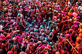 Nandgaon,India - 01 March 2023: Aerial view of people celebrating the holy colour festival at Shri And Baba Temple,Uttar Pradesh,India