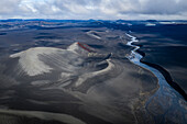 Aerial view of a grey plateau with lake at sunset in southern region of Iceland