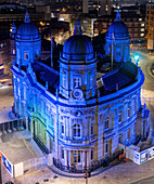 Aerial view of illuminated city hall and urban architecture at night,Hull,United Kingdom