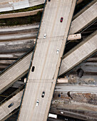 Aerial view of modern urban infrastructure with winding highways and vehicles at an intersection,Fort Worth,United States