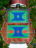 Aerial view of vibrant public housing and sports facilities including a basketball court and soccer court,Kallang,Singapore