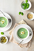 Basil soup with crème fraîche, pine nuts and pesto croutons