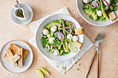 Green asparagus salad with rocket, avocado and mini mozzarella