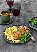 Leg of lamb with bean vegetables, fermented fennel and noodles