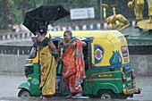 People travelling during Cyclone Remal, Tripura, India
