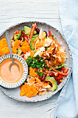 Grilled chicken salad with nachos, kidney beans and sweetcorn