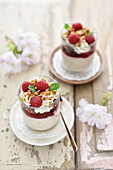Vegan 'rice pudding' dessert with berry compote and cream