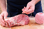 Tie the roast with kitchen twine