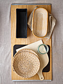 Moulds, proofing baskets, shovel, board, jar with lid for baking bread