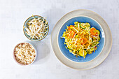 Indian brown rice pan with vegetables and sprouts