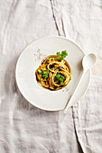 Spelt pasta with carrot pesto and pumpkin seeds