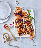 Grilled BBQ salmon skewers with radicchio and bacon