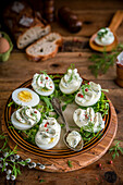 Stuffed eggs with cream cheese and mayonnaise on a bed of lettuce