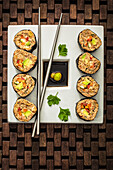 Vegetarian sushi with chopped walnuts and vegetables