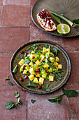 Indian pineapple salad with peppers, pomegranate and mint