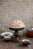 Chocolate cheesecake dome cake with sponge rolls