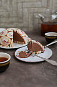 Chocolate cheesecake dome cake with sponge rolls