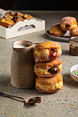 Doughnuts with jam, chocolate cream and vanilla cream