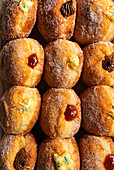Doughnuts with jam, chocolate cream and vanilla cream