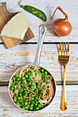 Cacio e Pepe spaghetti with peas and pecorino