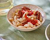 White bean salad with pecans and tomatoes