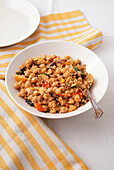 Couscous with chickpeas, vegetables and sesame sauce