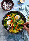 Vegetarian curry bowl with hard-boiled egg