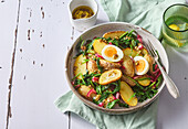Potato salad with spinach and hard-boiled egg