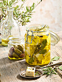 Marinated feta with rosemary and bay leaf in olive oil