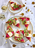 Toasts with beetroot spread, cheese and nuts