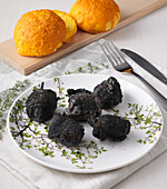 'Burnt' sea bass bites from the charcoal grill