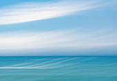 Blue and white abstract blur of sea and sky.
