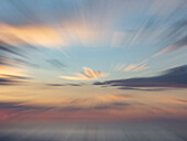 Zoom-blur image of sunset sky.