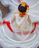 Mexico, San Miguel de Allende. Blurred motion view of woman dancing.