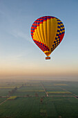 Africa, Egypt, Luxor. Hot air balloon's travel over the Valley of the Kings at sunrise.