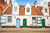 Bruges, Belgium. Wide angle view of cobbled streets and medieval buildings which make it a famous UNESCO tourist attraction. (Editorial Use Only)