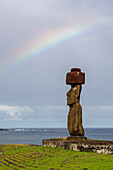 Chile, Easter Island, aka Rapa Nui, Ahu Tahai. Moai with rainbow. UNESCO World Heritage Site.