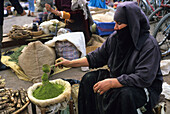Henna seller, souk in the Medina of Marrakech, Morocco