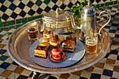Pastries designed by Pierre Herme, made by Richard Bourlon, with mint tea, Pavillion Menzeh, garden of La Mamounia Hotel, Marrakesh, Morocco
