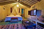 Bungalow room of Eco-lodge Hara Oasis on River Draa banks in large palm grove in Agdz at foot of Djebel Kissane (Mount Kissane), Draa-Tafilet region, Morocco