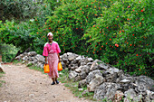 Woman on a path of Oum-er-Rbia valley, Khenifra region, Middle Atlas, Morocco