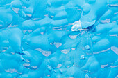 Glacial iceberg detail from ice calved off the Sawyer Glacier in Tracy Arm, Southeast Alaska, United States of America