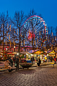 View of Christmas market and ferris wheel on Karl Johans Gate at dusk, Oslo, Norway, Scandinavia