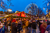 View of Christmas market and ferris wheel during winter at dusk, Stortingsparken, Oslo, Norway, Scandinavia