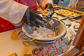 View of food making on Christmas Market stall in Altstadt Spandau, Spandau, Berlin, Germany