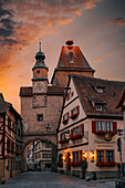 Plonlein (Little Square) and two towers of the old city wall, in the medieval town at sunrise, Rothenburg ob der Tauber, Bavaria, Germany